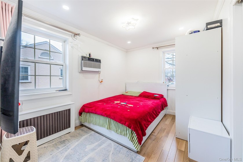 Step into this lovely 2/3-bedroom unit on the second floor of - photo 4