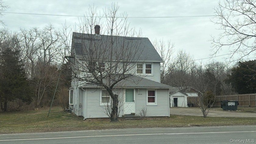 This colonial-style home features three bedrooms, two full baths - photo 3