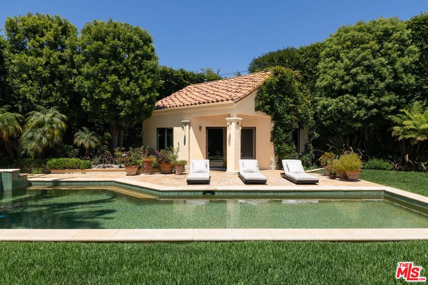 Set behind private gates with a circular driveway, this - photo 9