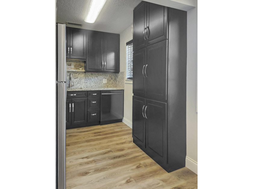 UPDATED! UPDATED! UPDATED! NEWLY RENOVATED CORNER UNIT ON THE - photo 9