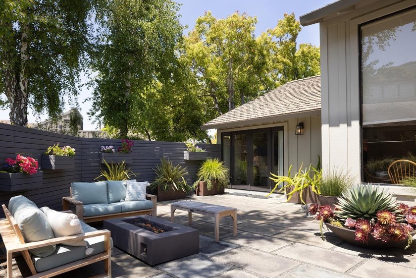 This exquisitely updated townhome enjoys privacy, sunshine, and - photo 8