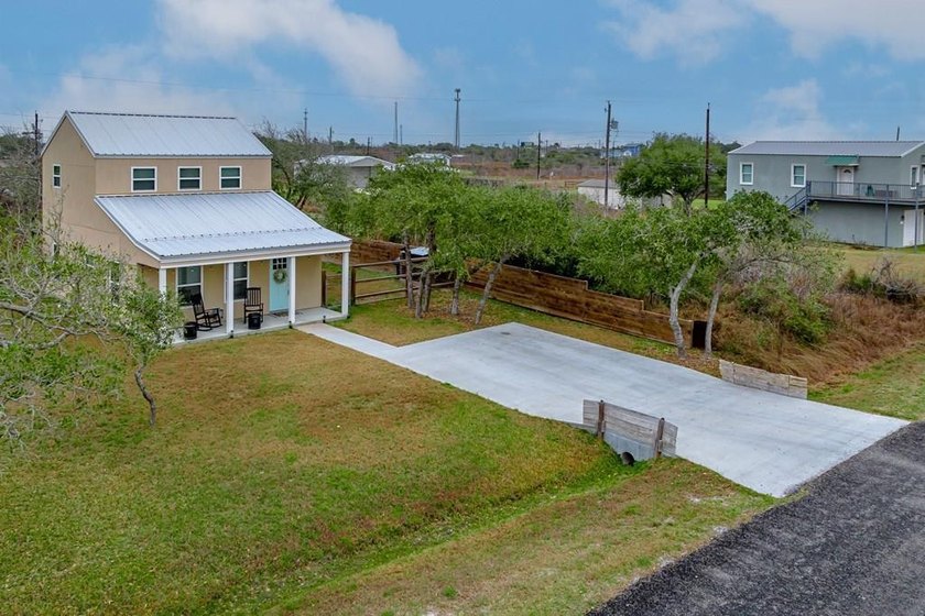 Nestled in the waterfront community of Holiday Beach, this - photo 3