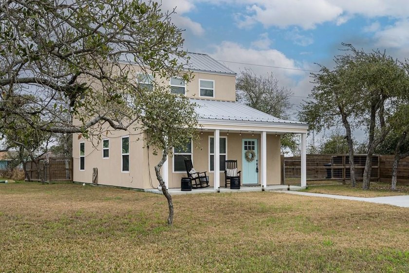 Nestled in the waterfront community of Holiday Beach, this - photo 4