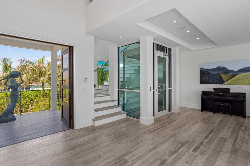 Welcome to this stunning 3-story townhouse in Ocean Ridge. This - photo 7