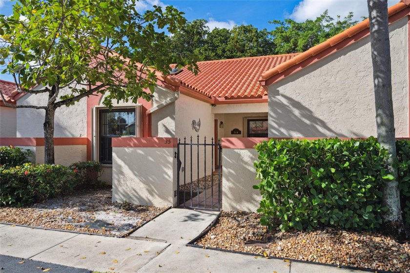 This beautifully updated villa-style home features an open - photo 22