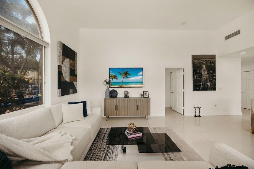 Updated 2BR/2BA corner residence with high ceilings, bright open - photo 3