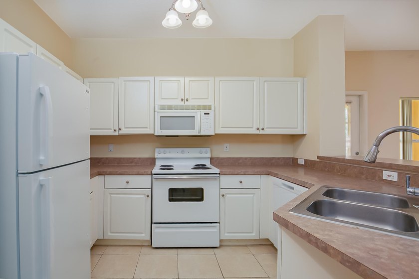 Discover easy coastal living in this beautifully maintained - photo 10