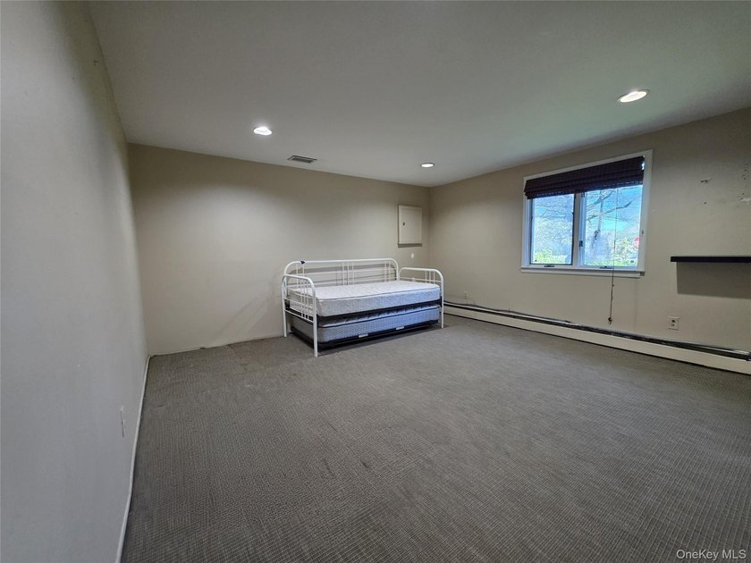 Spacious hi ranch with 4 bedrooms and 3 full bathrooms, set on - photo 13