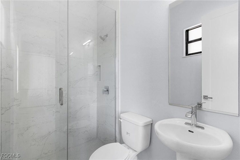 Step into luxury waterfront living with this stunning newly - photo 33
