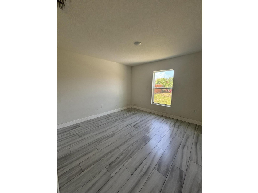 This beautifully updated 4-bedroom home with a den boasts new - photo 3