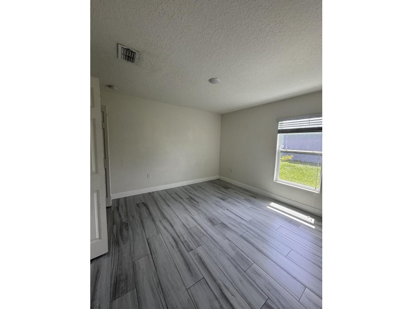 This beautifully updated 4-bedroom home with a den boasts new - photo 4
