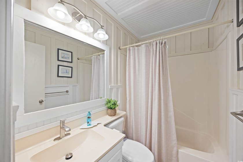 Charming, fully furnished, ocean view condo on Garden City Beach - photo 21