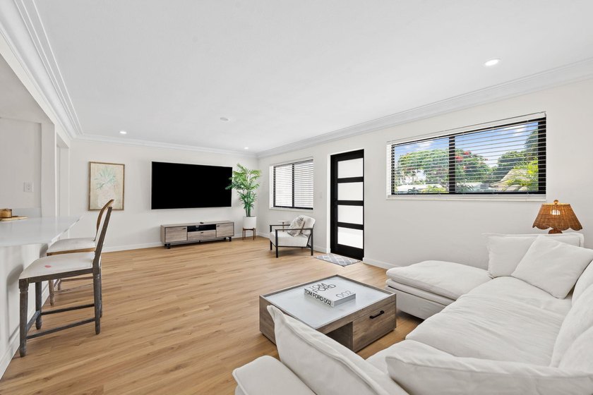 Welcome to this beautifully updated 3-bedroom, 2-bath residence - photo 2