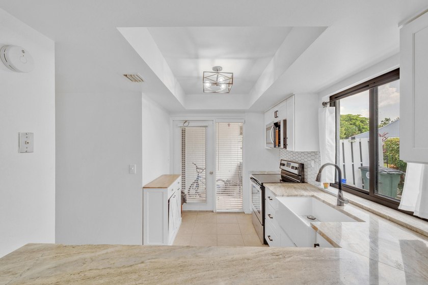 East Boca Villa Now Available for Sale or Lease! Discover the - photo 3