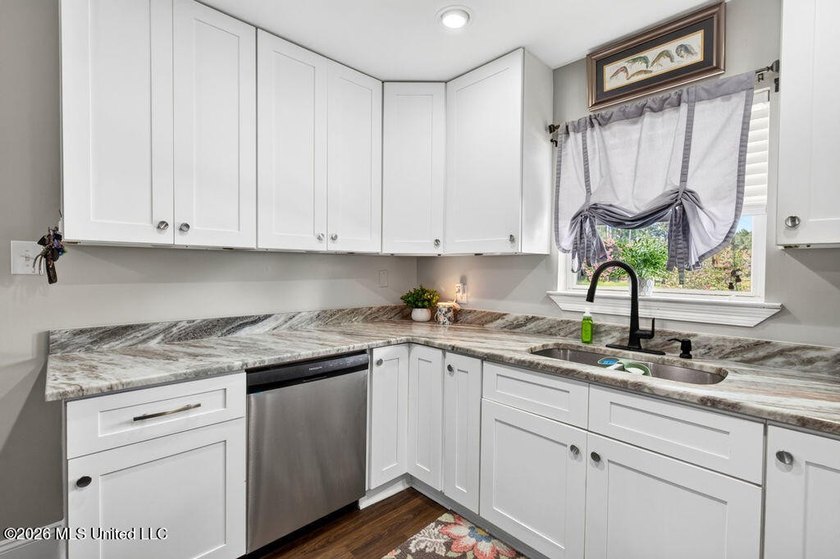 Welcome home to this inviting 4-bedroom, 2-bath home situated on - photo 12