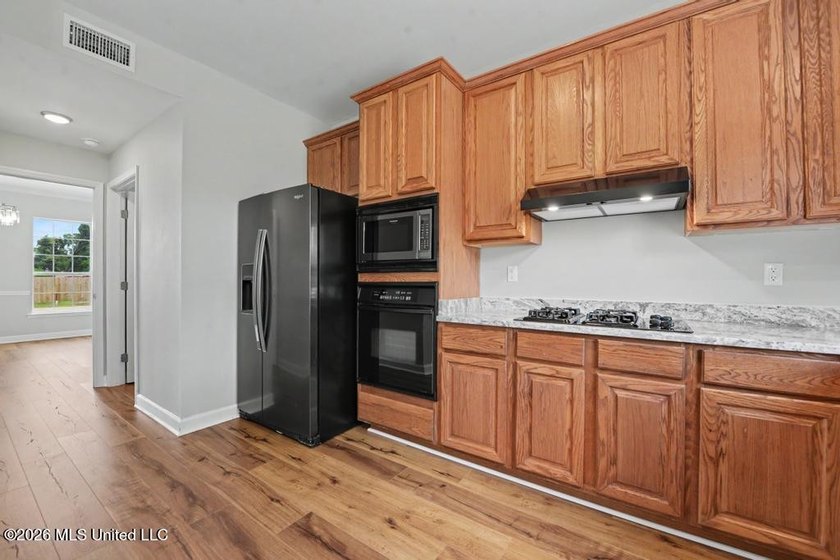 Beautifully updated 4-bedroom, 3-bath home located in the highly - photo 11