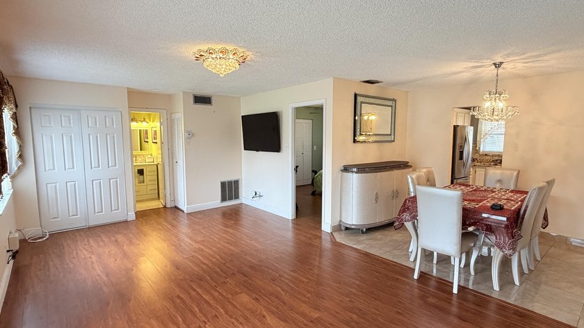 Wellmaintained 2ndfloor corner unit with a bright convertible - photo 3