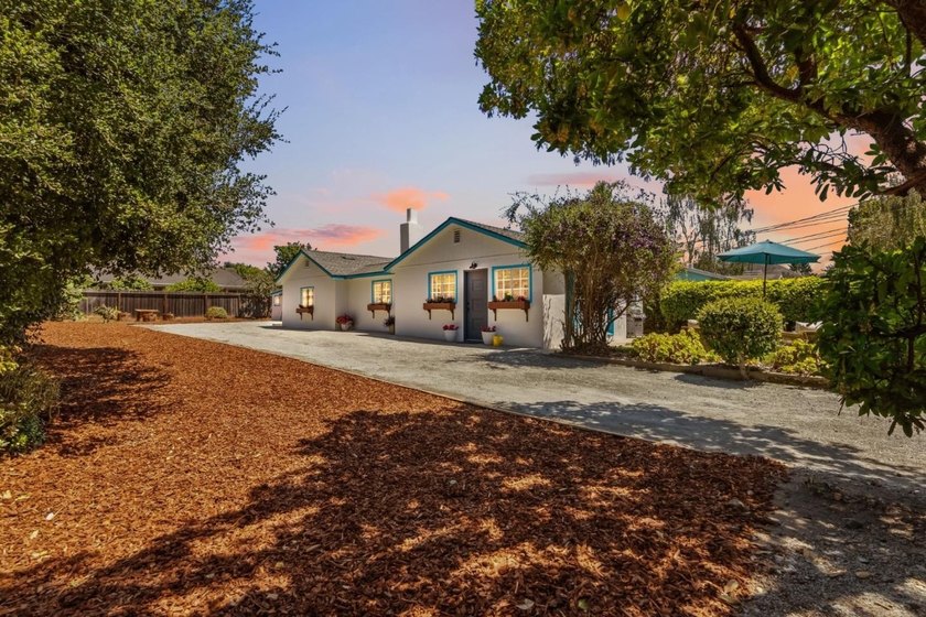 Ideally located on a quiet residential street in the highly - photo 2