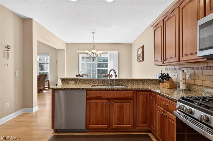 Discover this beautifully updated 3-bedroom cluster home in the - photo 12