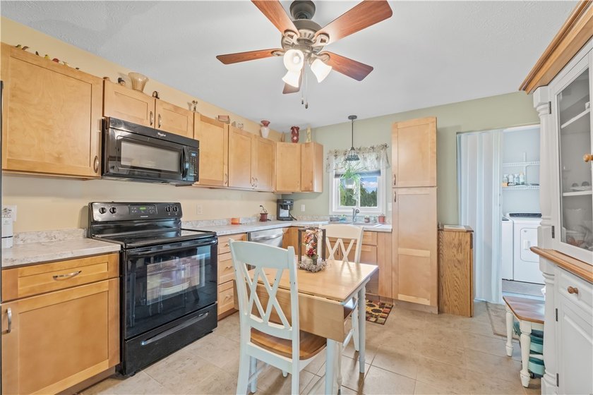 Nestled on a 1.34-acre lot in Webster, this spacious 5-bedroom - photo 18