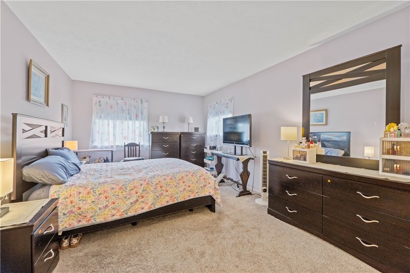 Nestled on a 1.34-acre lot in Webster, this spacious 5-bedroom - photo 21