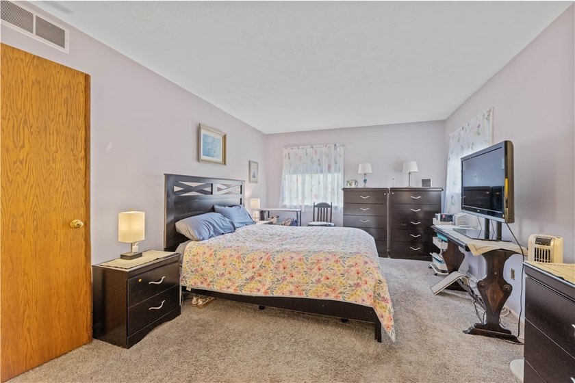 Nestled on a 1.34-acre lot in Webster, this spacious 5-bedroom - photo 22