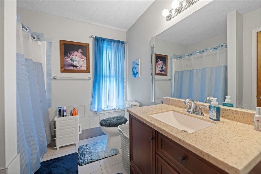 Nestled on a 1.34-acre lot in Webster, this spacious 5-bedroom - photo 26