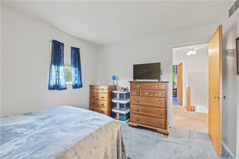 Nestled on a 1.34-acre lot in Webster, this spacious 5-bedroom - photo 28