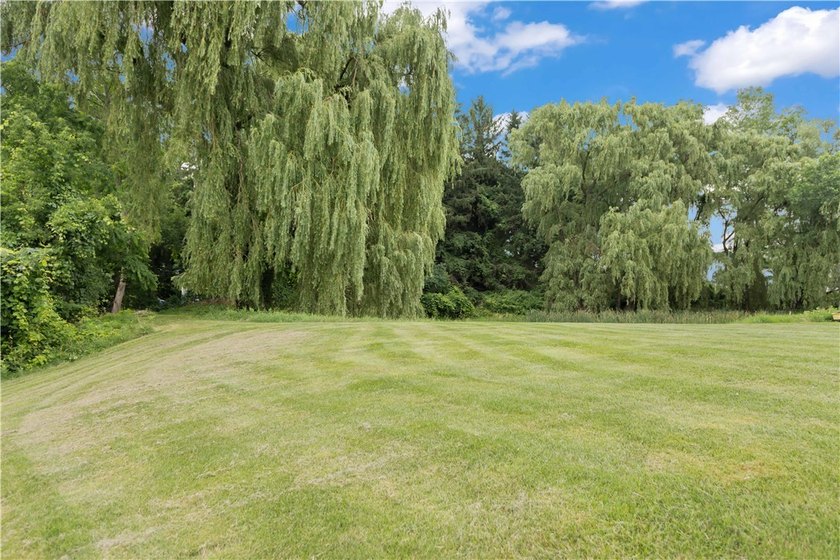 Nestled on a 1.34-acre lot in Webster, this spacious 5-bedroom - photo 33