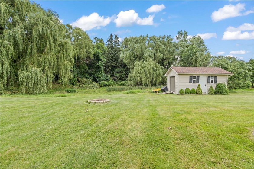 Nestled on a 1.34-acre lot in Webster, this spacious 5-bedroom - photo 36