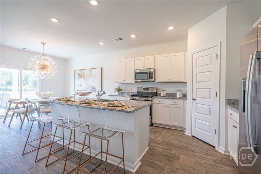 This single-story Hartford home design features an open space - photo 4