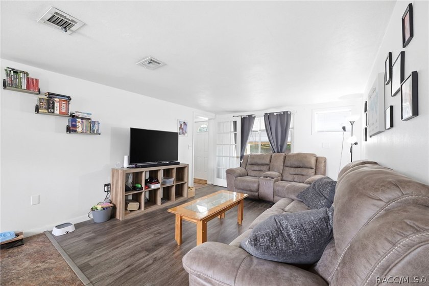 Nestled on a thoughtfully 0.14-acre lot, this charming 2-bedroom - photo 3