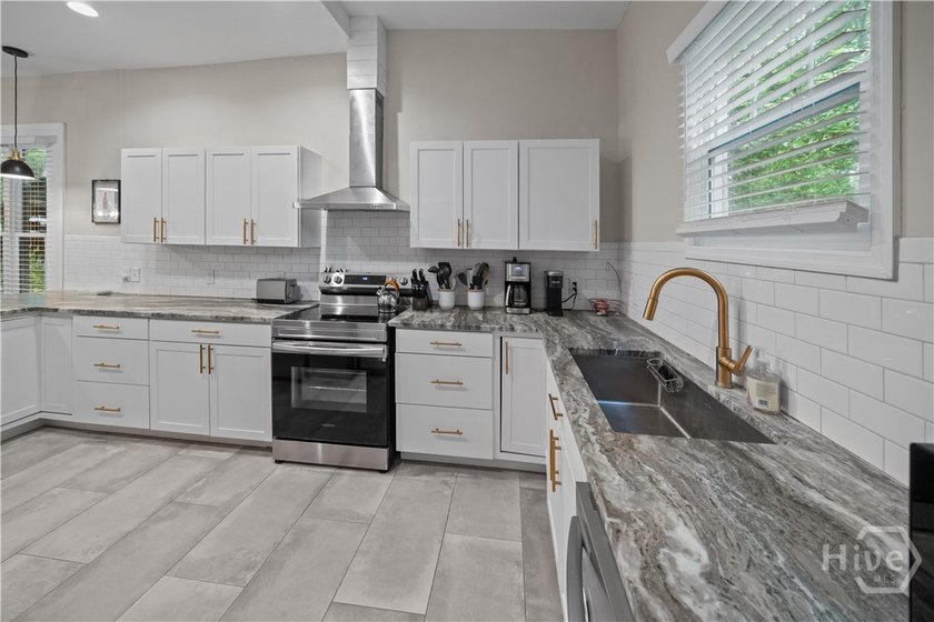 Step into timeless charm with modern luxury in this beautifully - photo 8