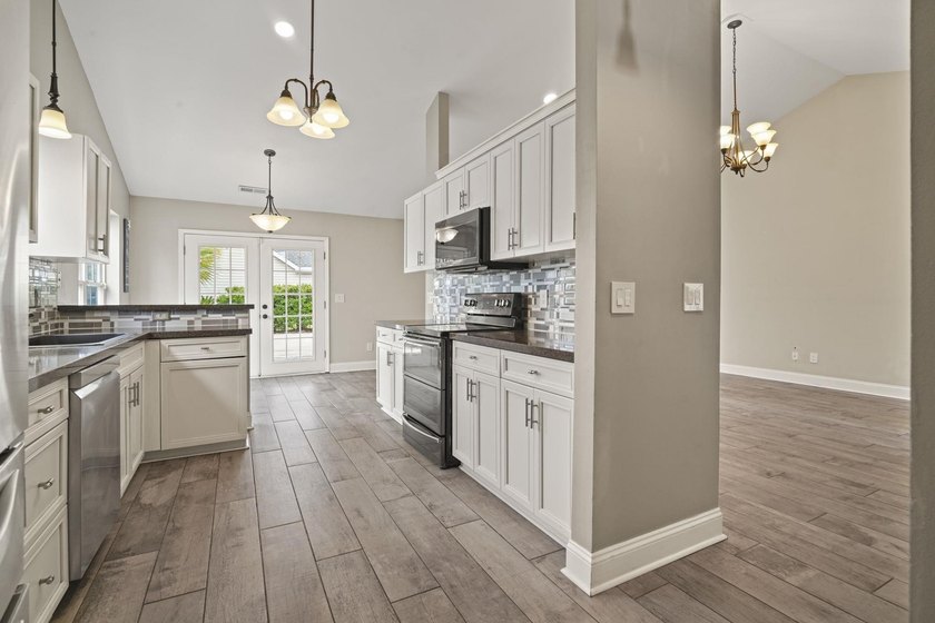 Welcome to 262 Palladium Drive, a beautifully maintained custom - photo 13