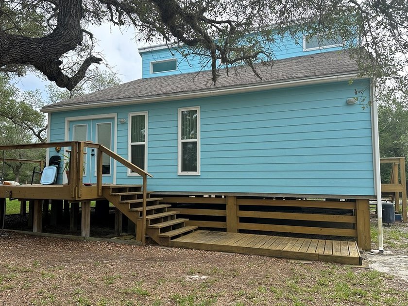 Tucked away on 2 private, oak-studded acres, this peaceful - photo 3