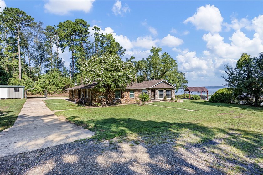 Tucked away along the shoreline of Lake Dardanelle, this - photo 3