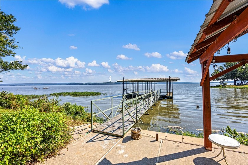 Tucked away along the shoreline of Lake Dardanelle, this - photo 5