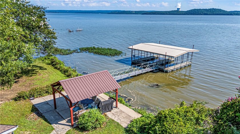 Tucked away along the shoreline of Lake Dardanelle, this - photo 6