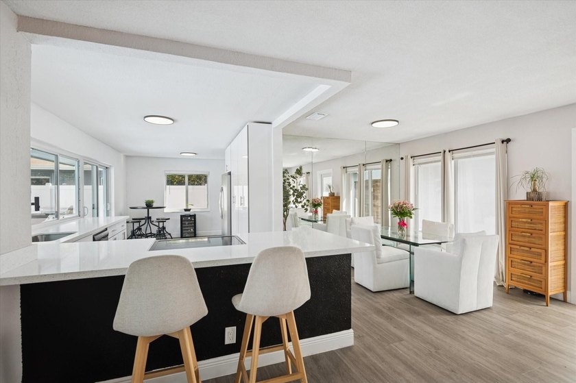 All remodeled with a new open kitchen and large impact sliders - photo 3