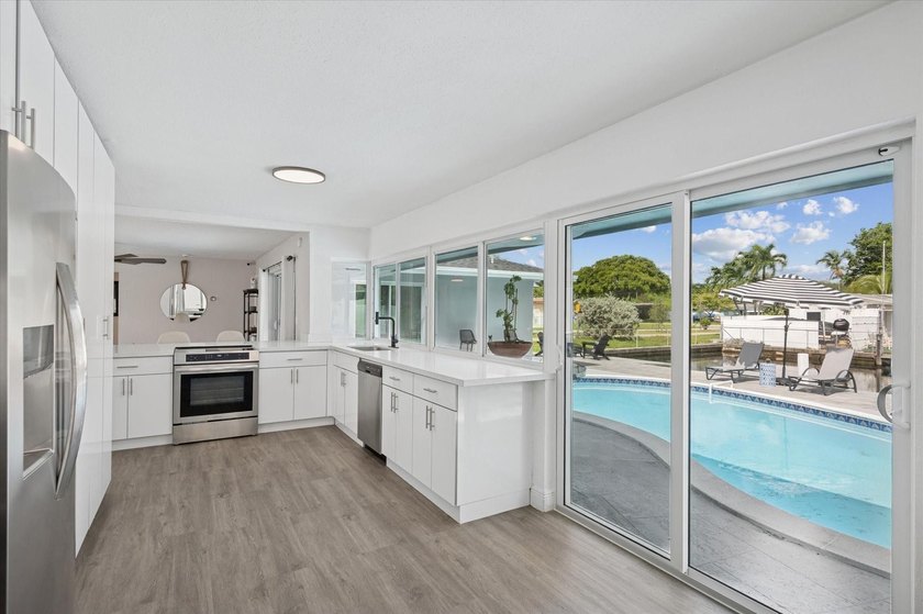 All remodeled with a new open kitchen and large impact sliders - photo 8