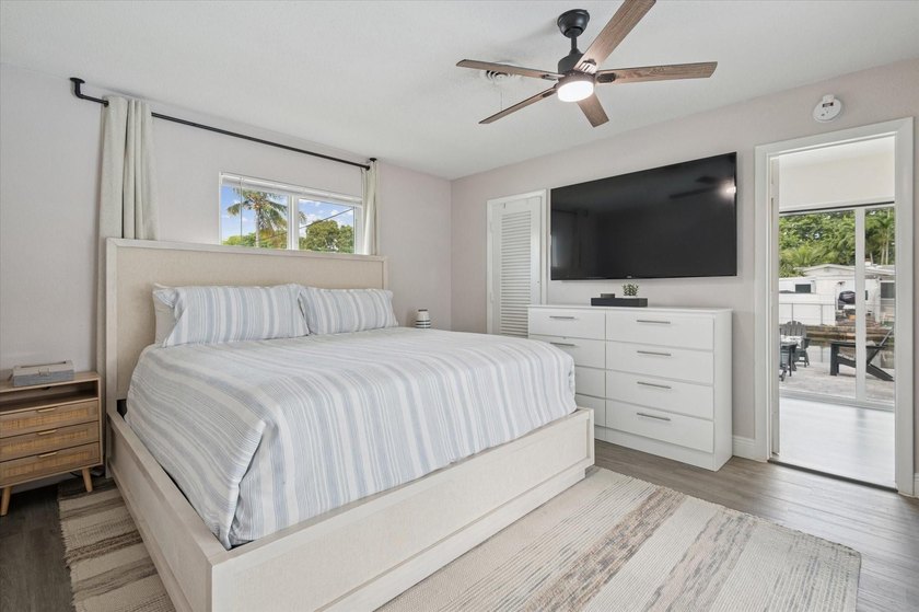 All remodeled with a new open kitchen and large impact sliders - photo 9
