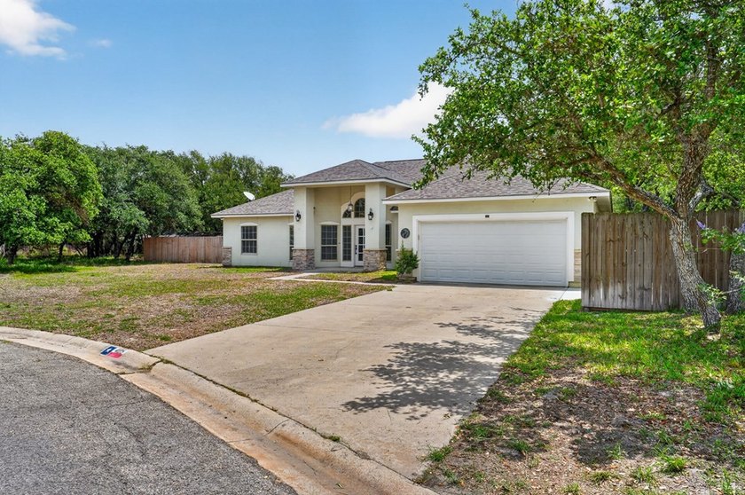 This lovely 2051 sq. ft. stucco home sits on a large lot in the - photo 3