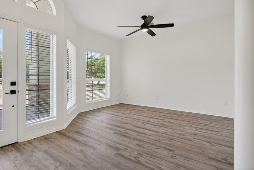 This lovely 2051 sq. ft. stucco home sits on a large lot in the - photo 6