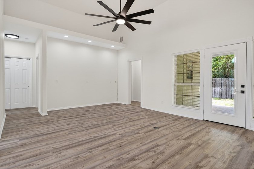 This lovely 2051 sq. ft. stucco home sits on a large lot in the - photo 9