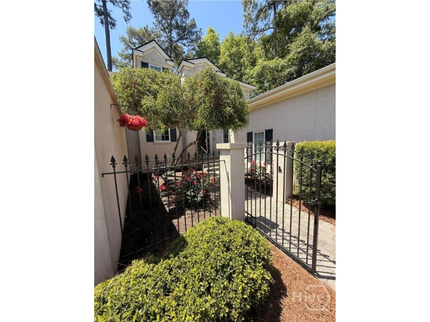 An exceptional townhome nestled within the gated enclave of - photo 3