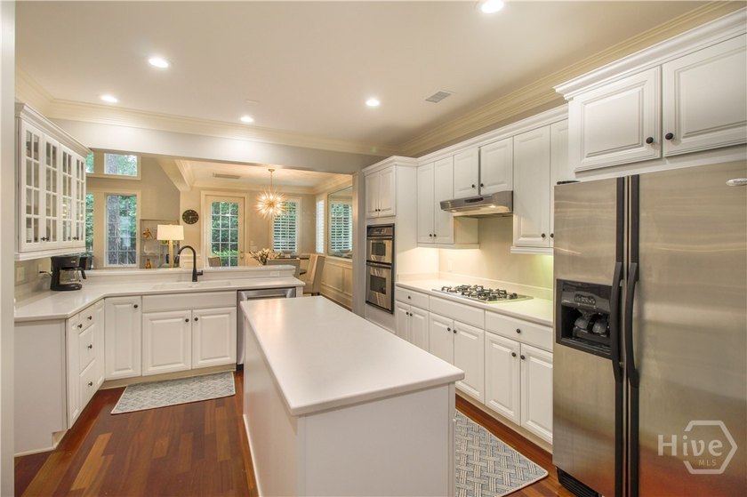 An exceptional townhome nestled within the gated enclave of - photo 9
