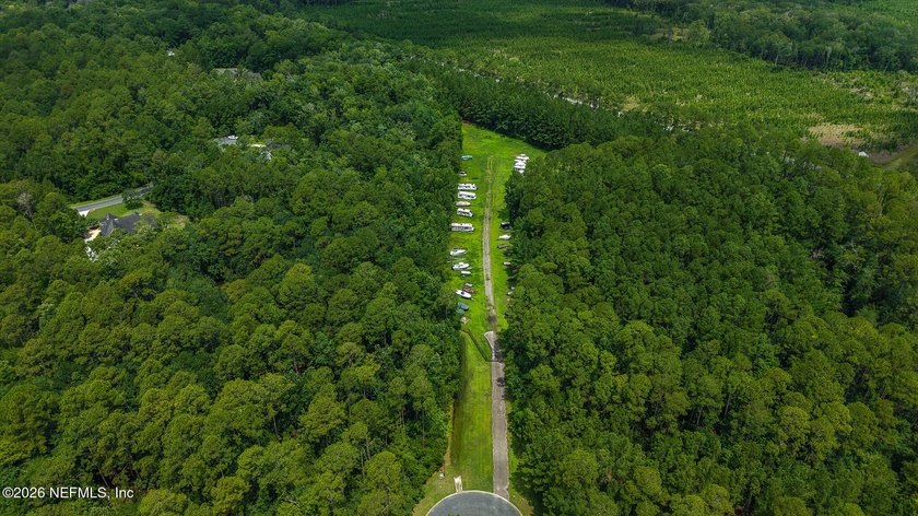 Approximately 1.98-acre wooded homesite located in the gated - photo 5