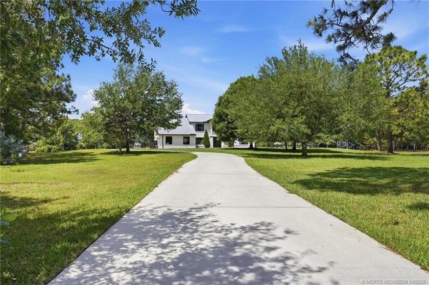 Experience privacy and luxury in one of Palm City's most - photo 6