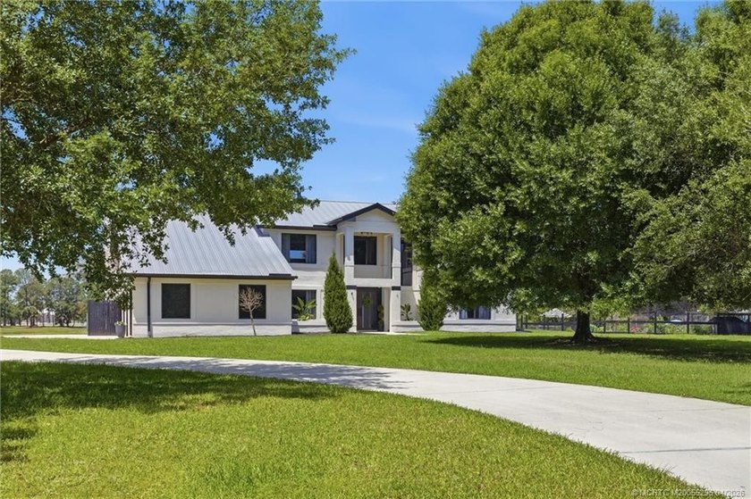 Experience privacy and luxury in one of Palm City's most - photo 7