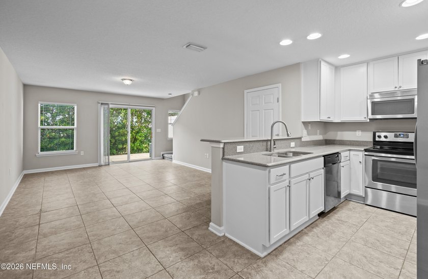 BEST-PRICED TOWNHOME IN THE GATED ISLANDER COMMUNITY ON - photo 3
